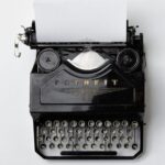 black Fayorit typewriter with printer paper