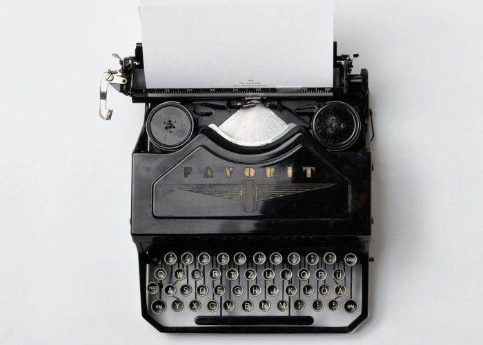 black Fayorit typewriter with printer paper